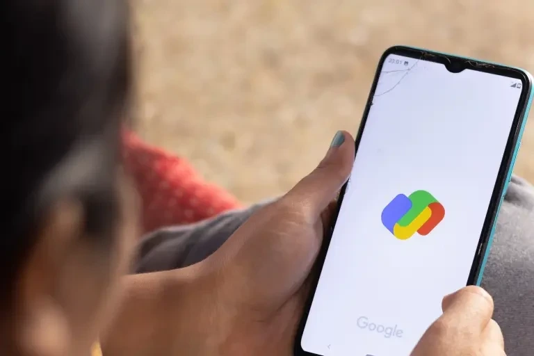 Person looking at mobile while opening google pay app in screen 